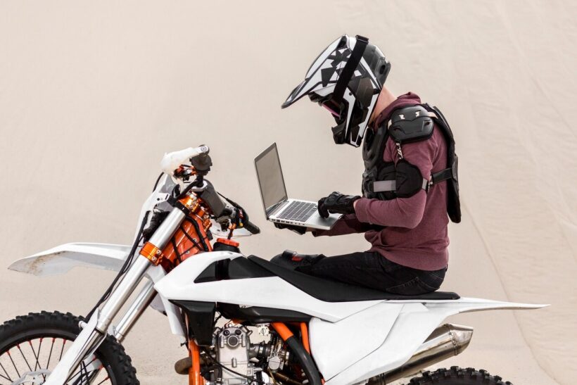 motorcycle rider and laptop