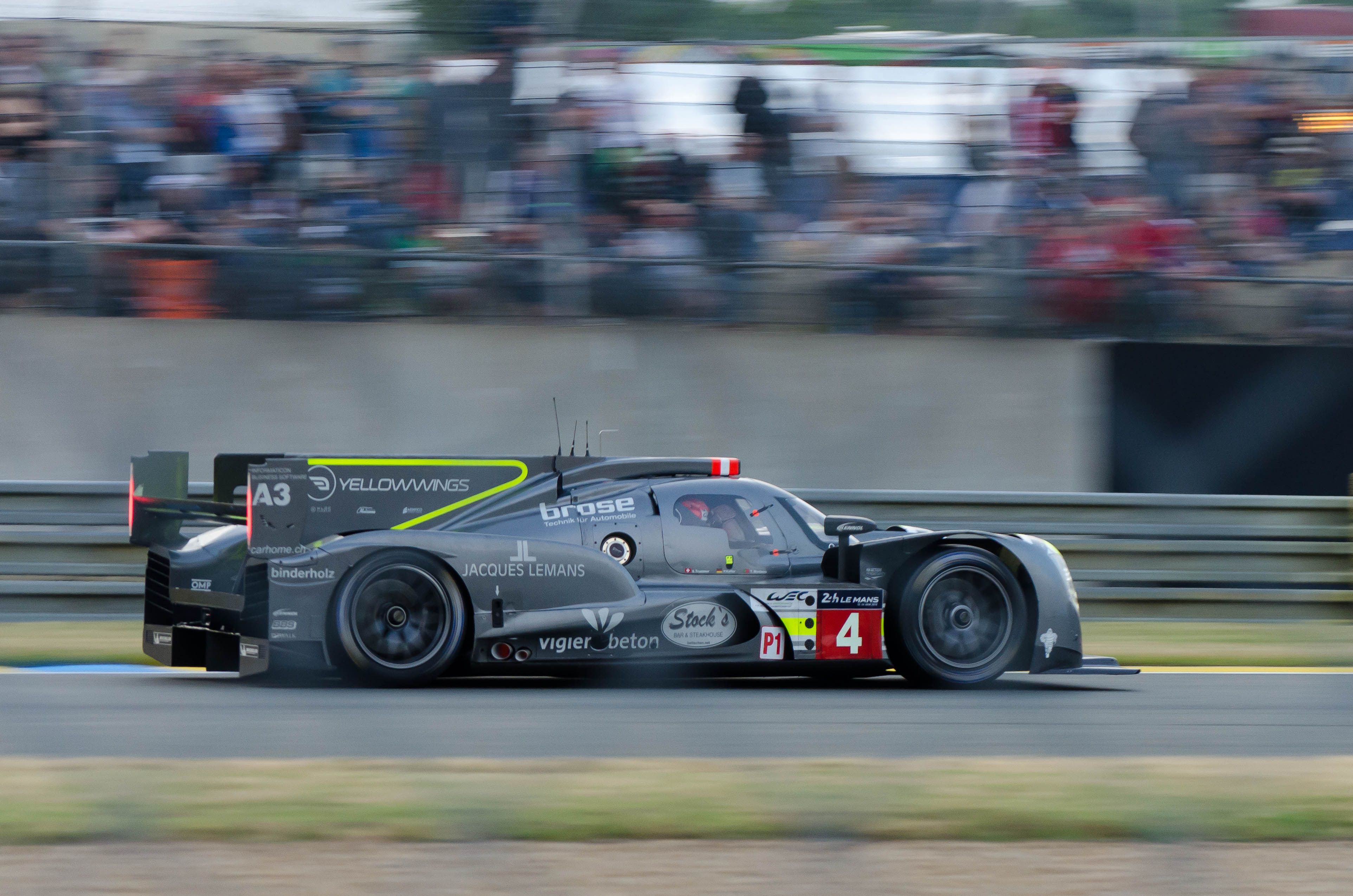 Racing car speeding on the Le Mans circuit, capturing the essence of endurance racing and long-distance motorsport engineering