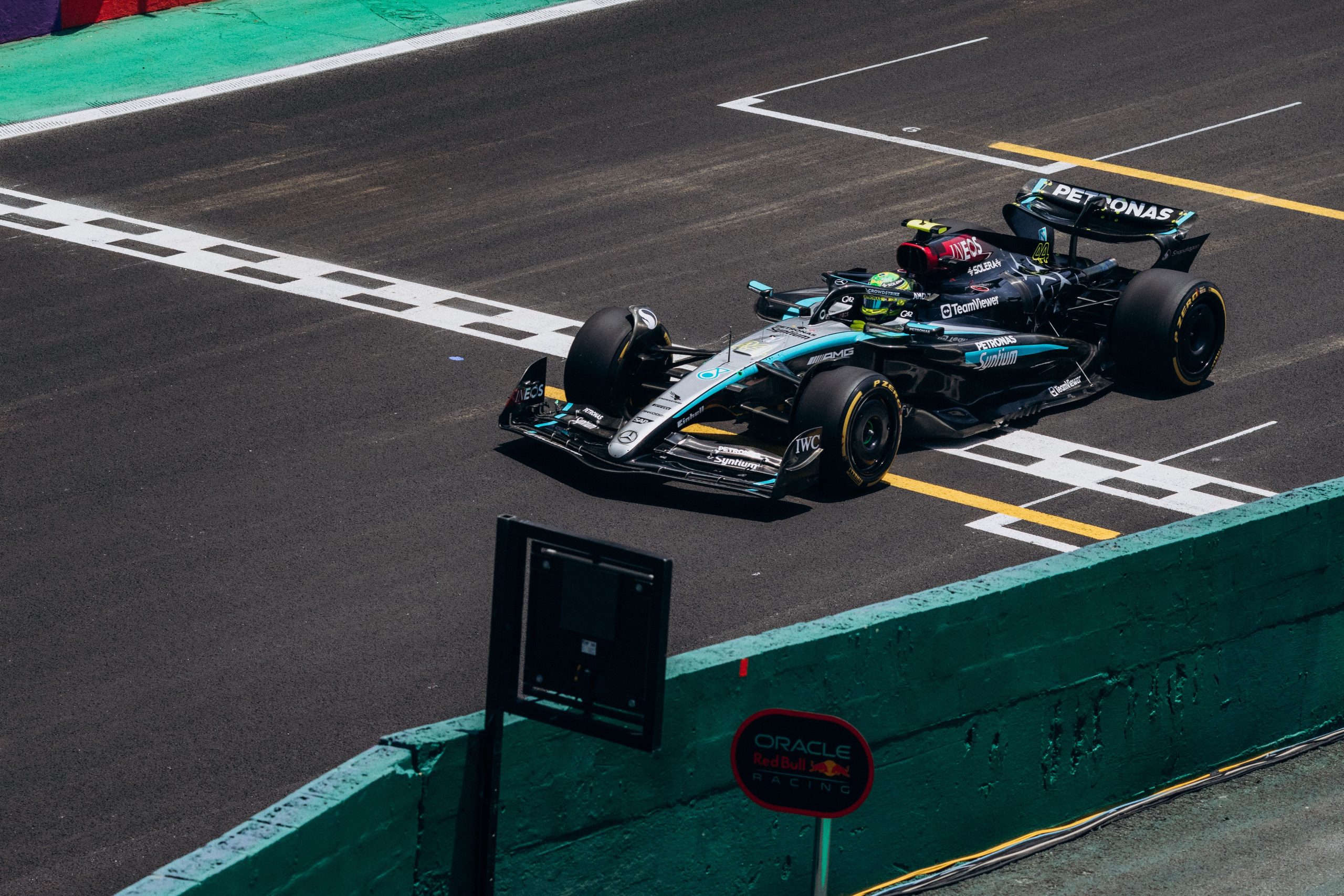 Formula 1 car crossing the finish line at high speed during a grand prix race weekend